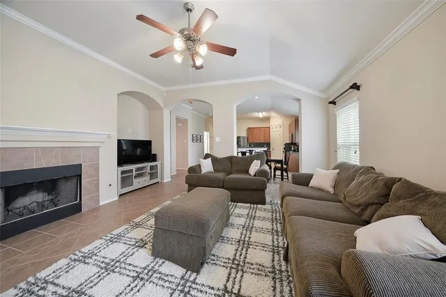 a living room with furniture fireplace and a fireplace