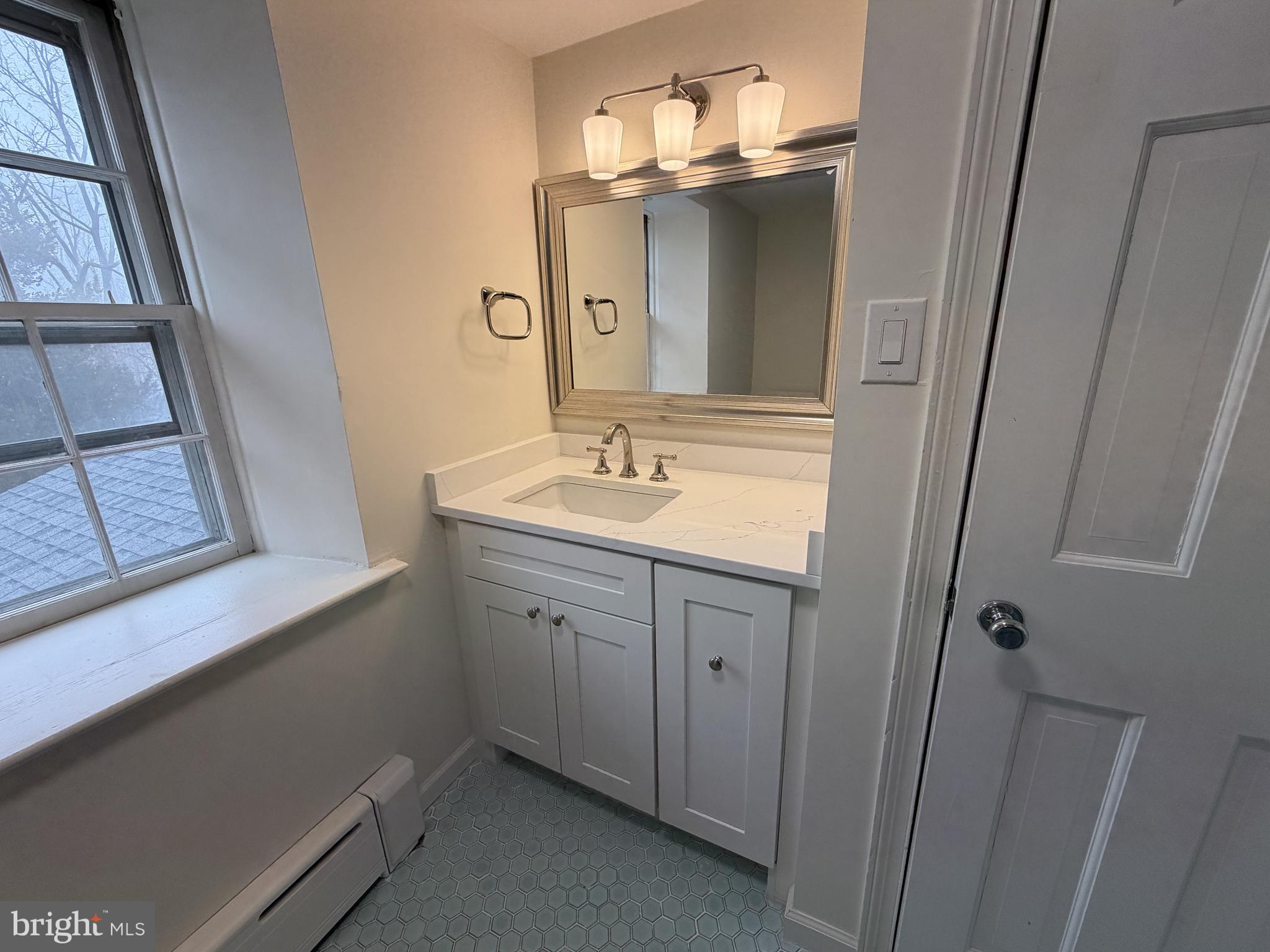 4700 Thompsons Bridge Road Wilmington, DE 19803 - Photo 31 of 41 a bathroom with a sink and a mirror