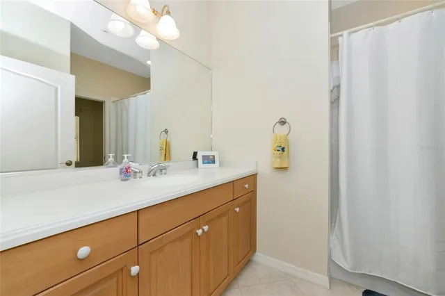 a bathroom with a sink and mirror