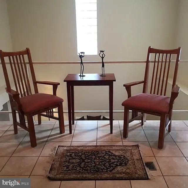 261 Queen Street, Unit 1 Philadelphia, PA 19147 - Photo 11 of 14 a view of a hallway with chairs and a potted plant