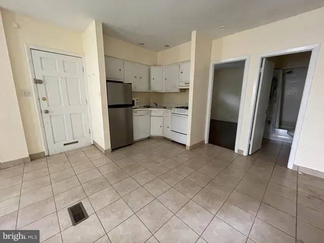 a kitchen with stainless steel appliances a refrigerator and a sink