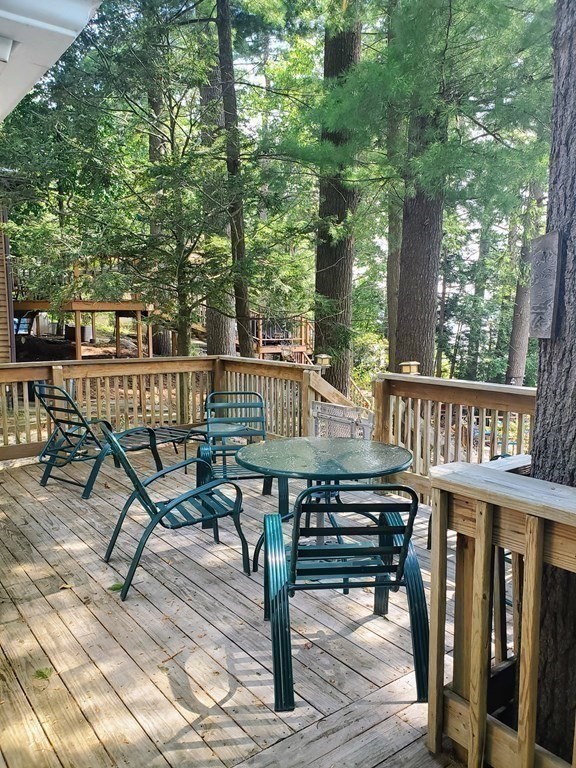 154 Lake Road Sturbridge, MA 01518 - Photo 14 of 39 a view of a chairs and tables in the balcony
