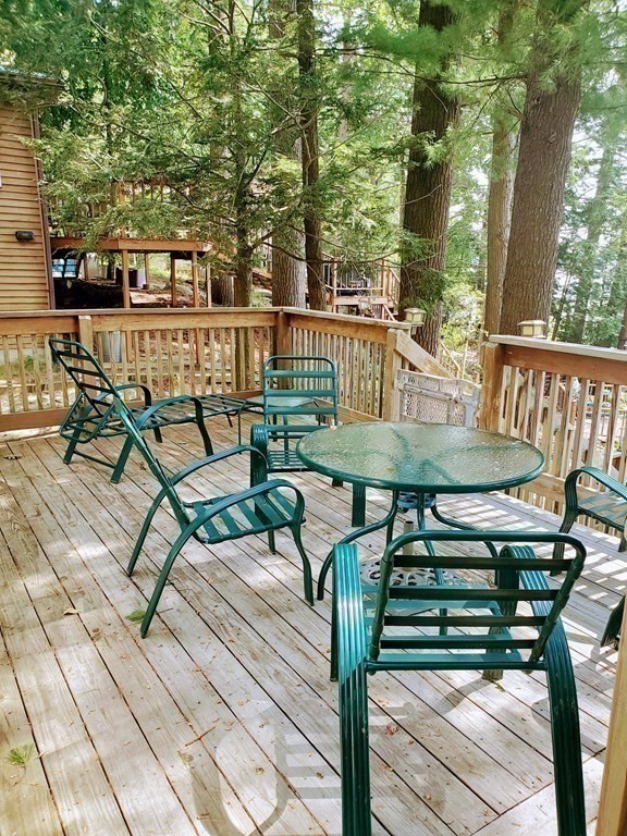 154 Lake Road Sturbridge, MA 01518 - Photo 15 of 39 a view of a chairs and table on the terrace