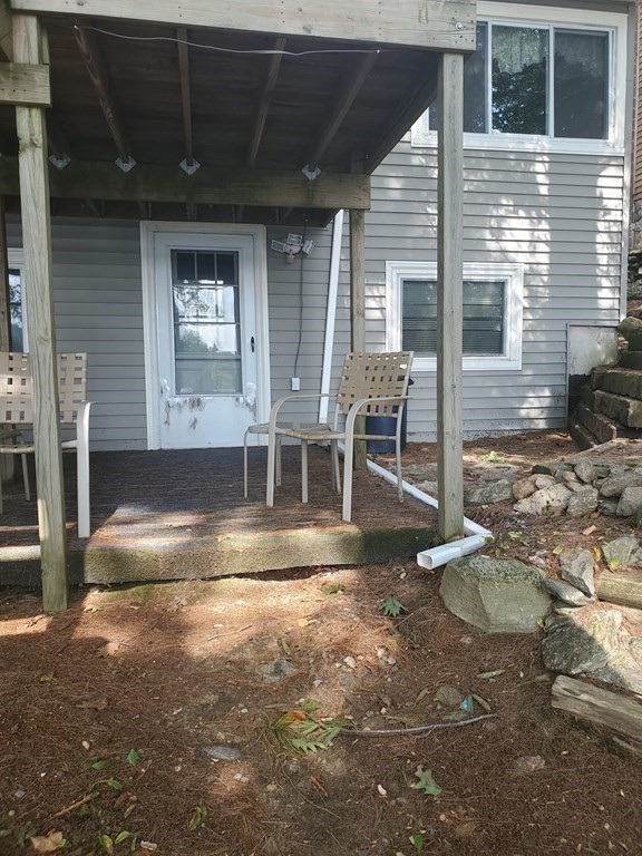 154 Lake Road Sturbridge, MA 01518 - Photo 22 of 39 a view of a house with a patio