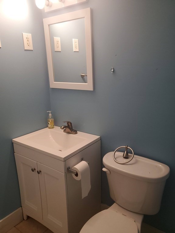 154 Lake Road Sturbridge, MA 01518 - Photo 25 of 39 a bathroom with a toilet sink and mirror
