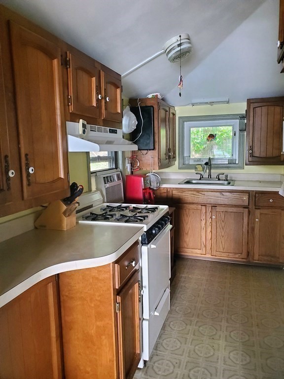 154 Lake Road Sturbridge, MA 01518 - Photo 3 of 39 a kitchen with stainless steel appliances granite countertop a sink stove and refrigerator