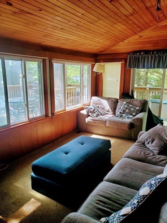154 Lake Road Sturbridge, MA 01518 - Photo 5 of 39 a living room with furniture and a large window