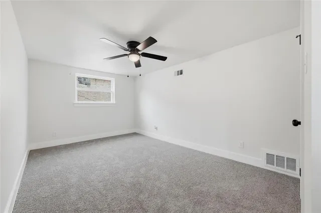 a view of a big room with carpet