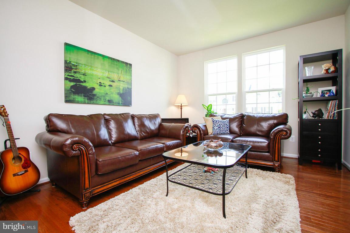 10502 Windlass Run Road Baltimore, MD 21220 - Photo 11 of 26 a living room with furniture and a window