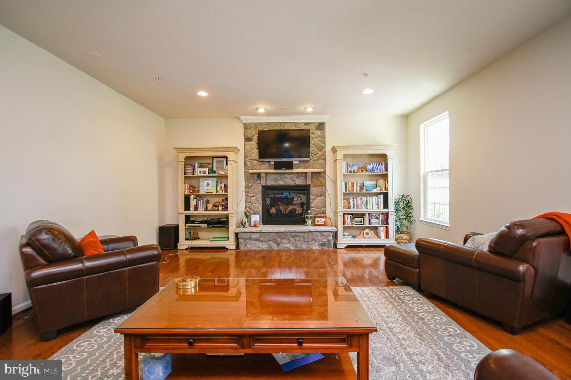 10502 Windlass Run Road Baltimore, MD 21220 - Photo 15 of 26 a living room with furniture and a flat screen tv