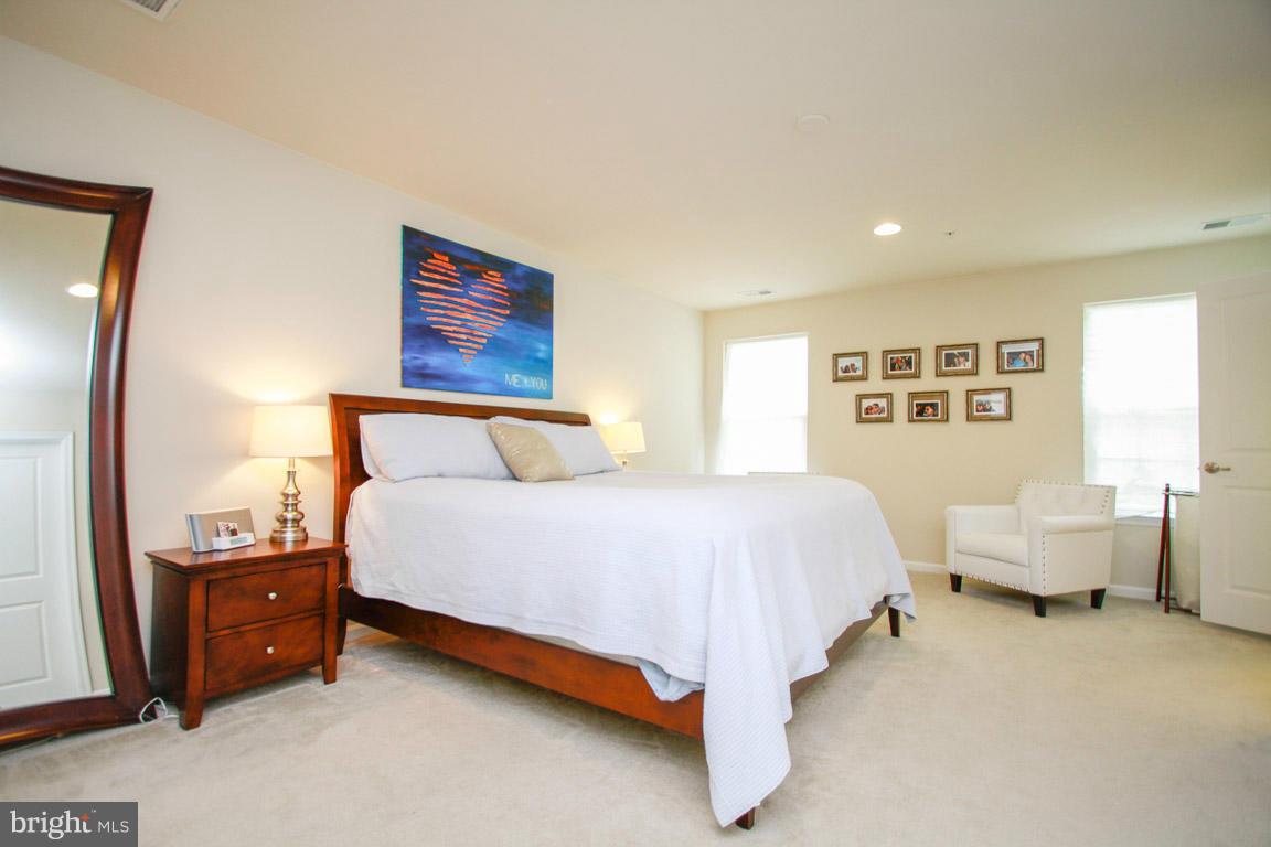 10502 Windlass Run Road Baltimore, MD 21220 - Photo 19 of 26 a spacious bedroom with a bed and window
