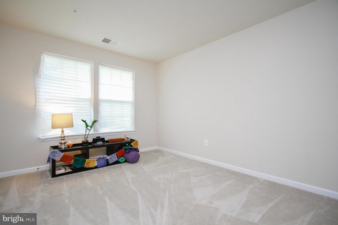 10502 Windlass Run Road Baltimore, MD 21220 - Photo 21 of 26 a room with a bed and a window