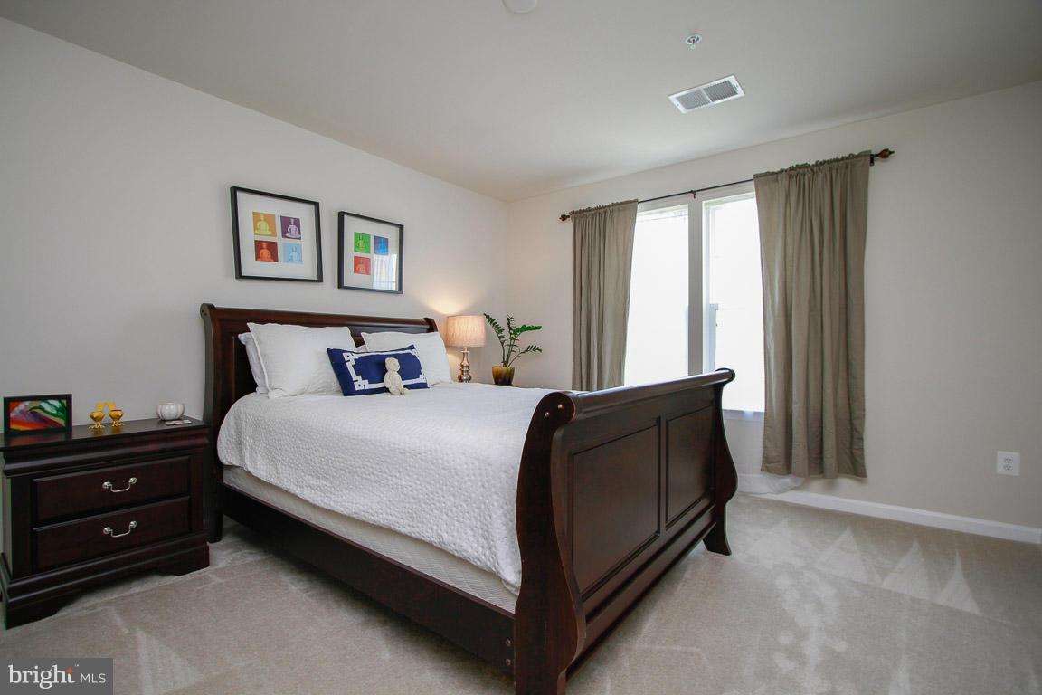 10502 Windlass Run Road Baltimore, MD 21220 - Photo 23 of 26 a bedroom with a bed and a window
