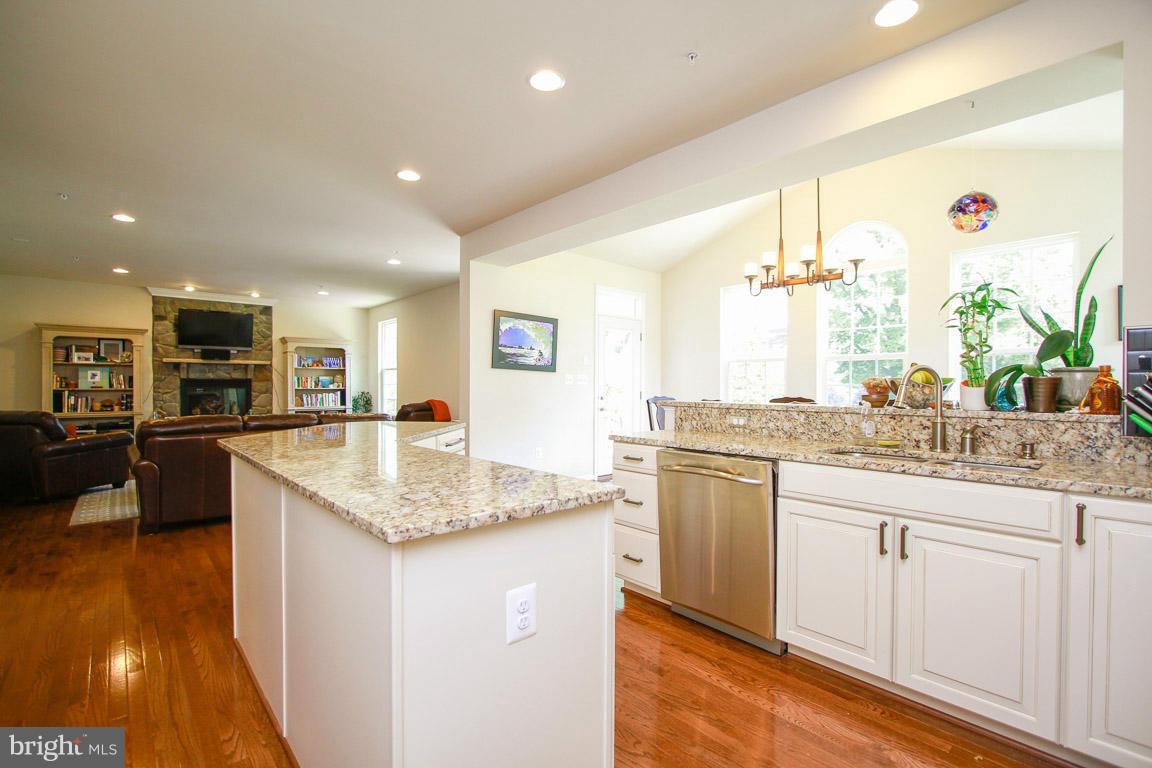 10502 Windlass Run Road Baltimore, MD 21220 - Photo 4 of 26 a kitchen with stainless steel appliances granite countertop a sink counter space and cabinets