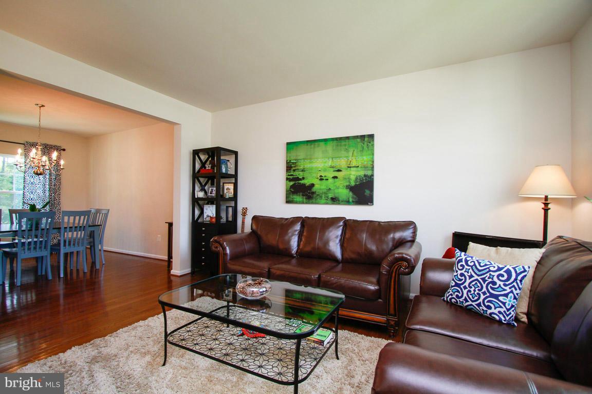 10502 Windlass Run Road Baltimore, MD 21220 - Photo 10 of 26 a living room with furniture and a wooden floor