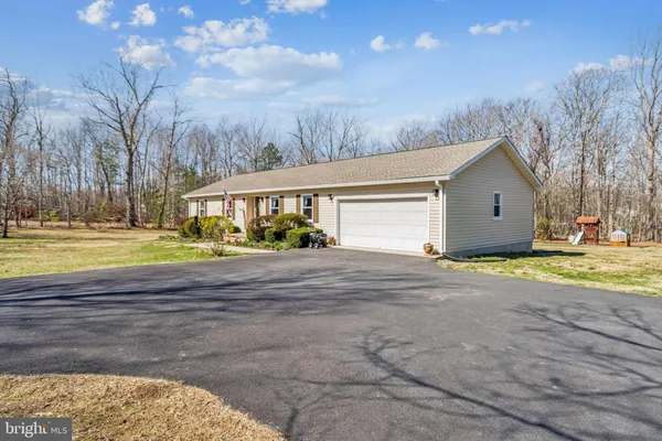 a view of outdoor space yard and front view of a house
