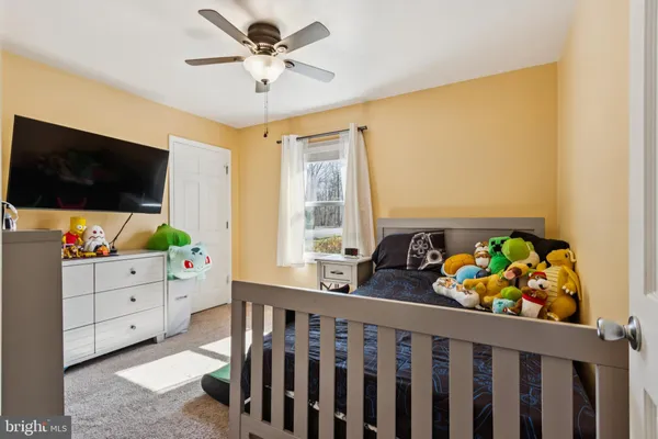 a kitchen with a refrigerator and cabinets