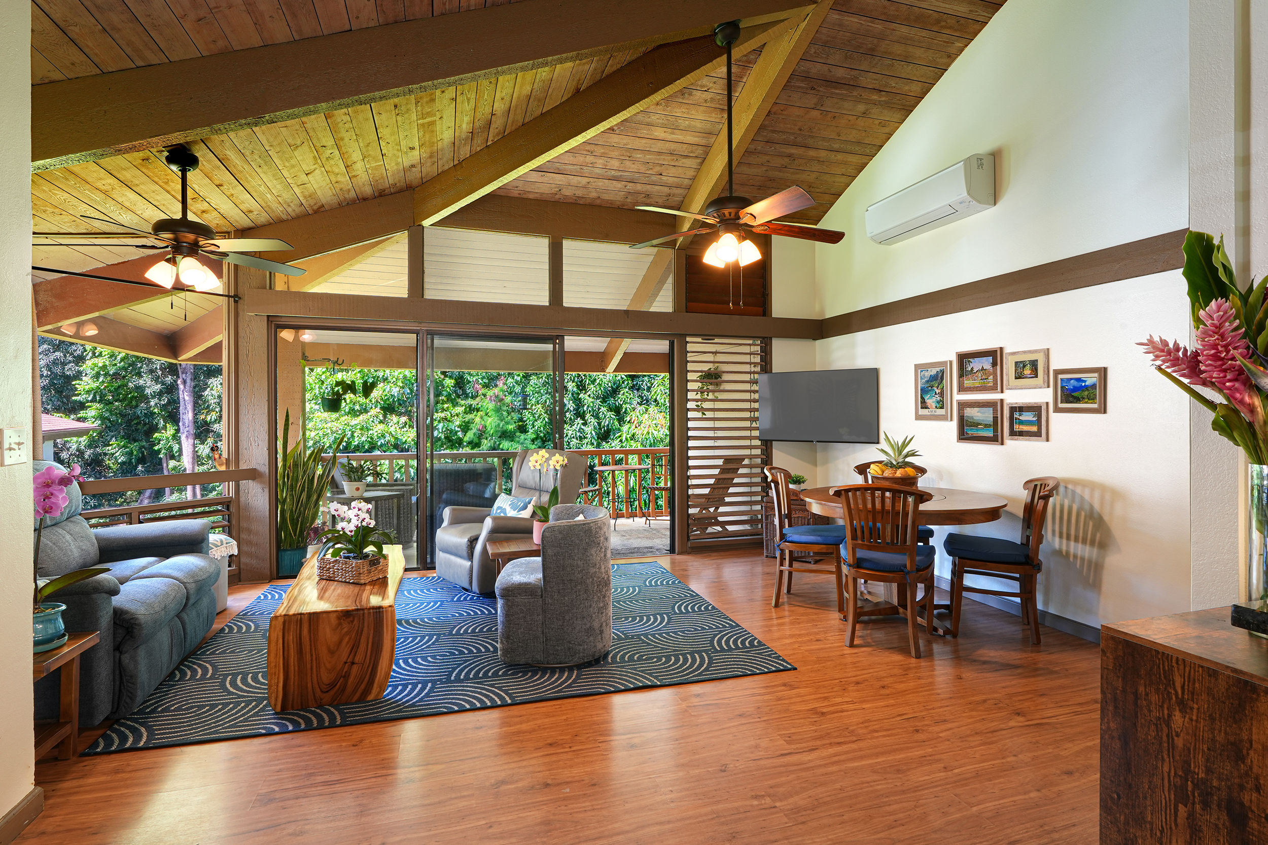 4701 Kawaihau Road, Unit F201 Kapaa, HI 96746 - Photo 3 of 11 a living room with furniture a table and chairs