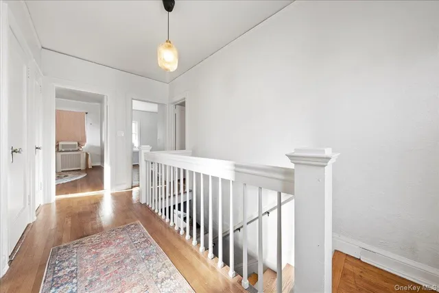 a view of a hallway with a chandelier