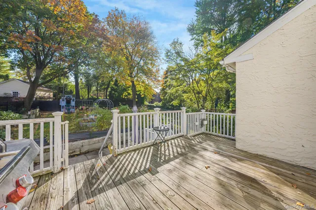 a balcony view with wooden floor