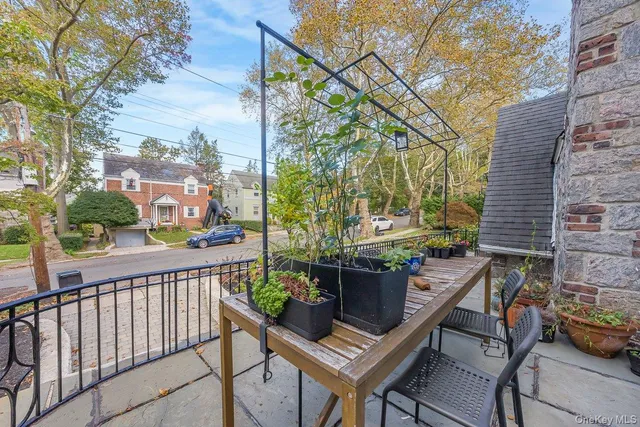 a view of balcony with wooden floor