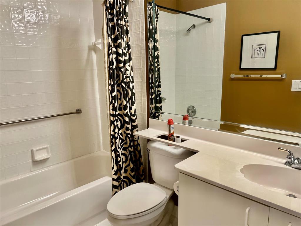 9539 Weldon Circle, Unit F406 Tamarac, FL 33321 - Photo 15 of 22 a bathroom with a sink toilet and shower