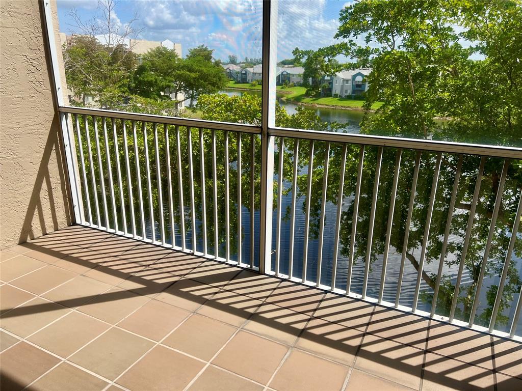 9539 Weldon Circle, Unit F406 Tamarac, FL 33321 - Photo 16 of 22 a balcony view