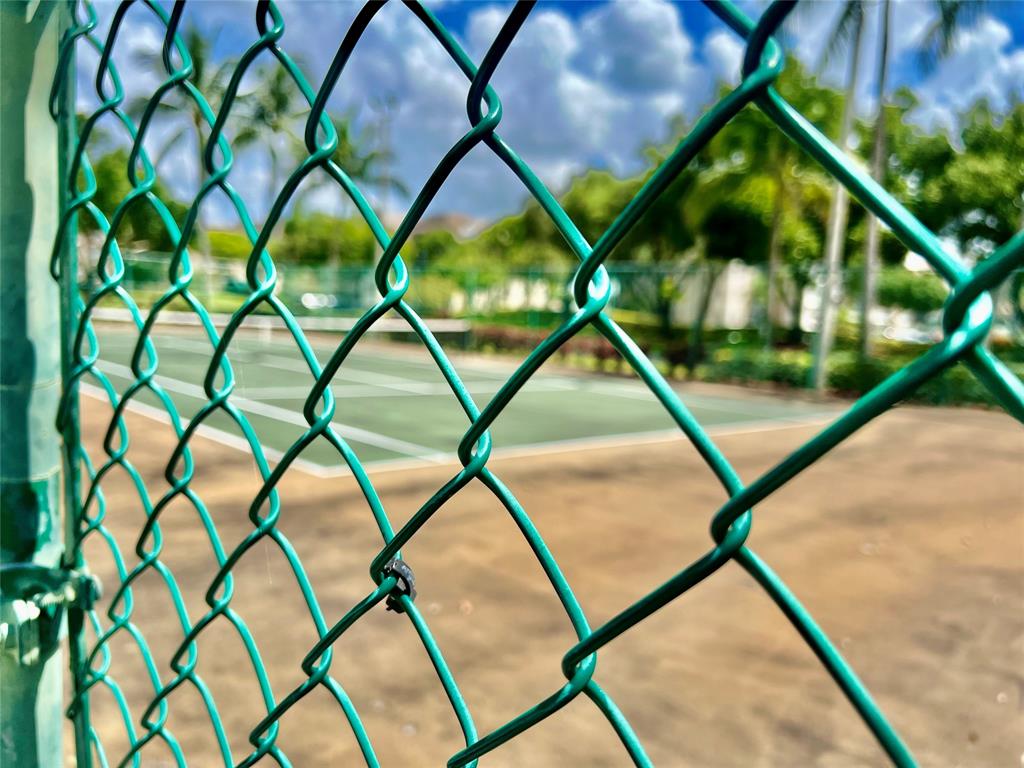 9539 Weldon Circle, Unit F406 Tamarac, FL 33321 - Photo 22 of 22 a view of an tree in a backyard