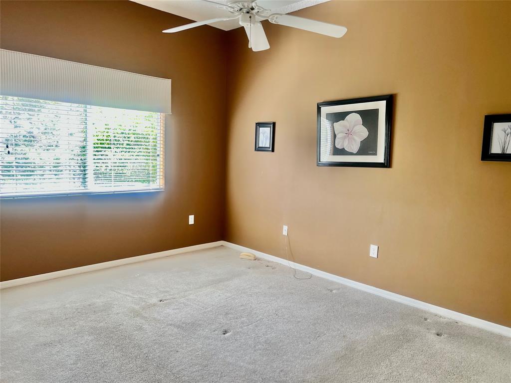 9539 Weldon Circle, Unit F406 Tamarac, FL 33321 - Photo 9 of 22 a view of an empty room with a window