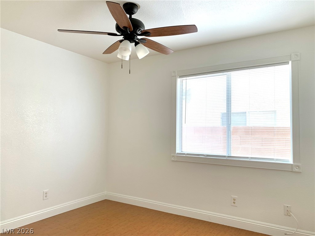 3821 Bombastic Court Las Vegas, NV 89147 - Photo 14 of 36 This bright room features a large window, offering abundant natural light and comfort.