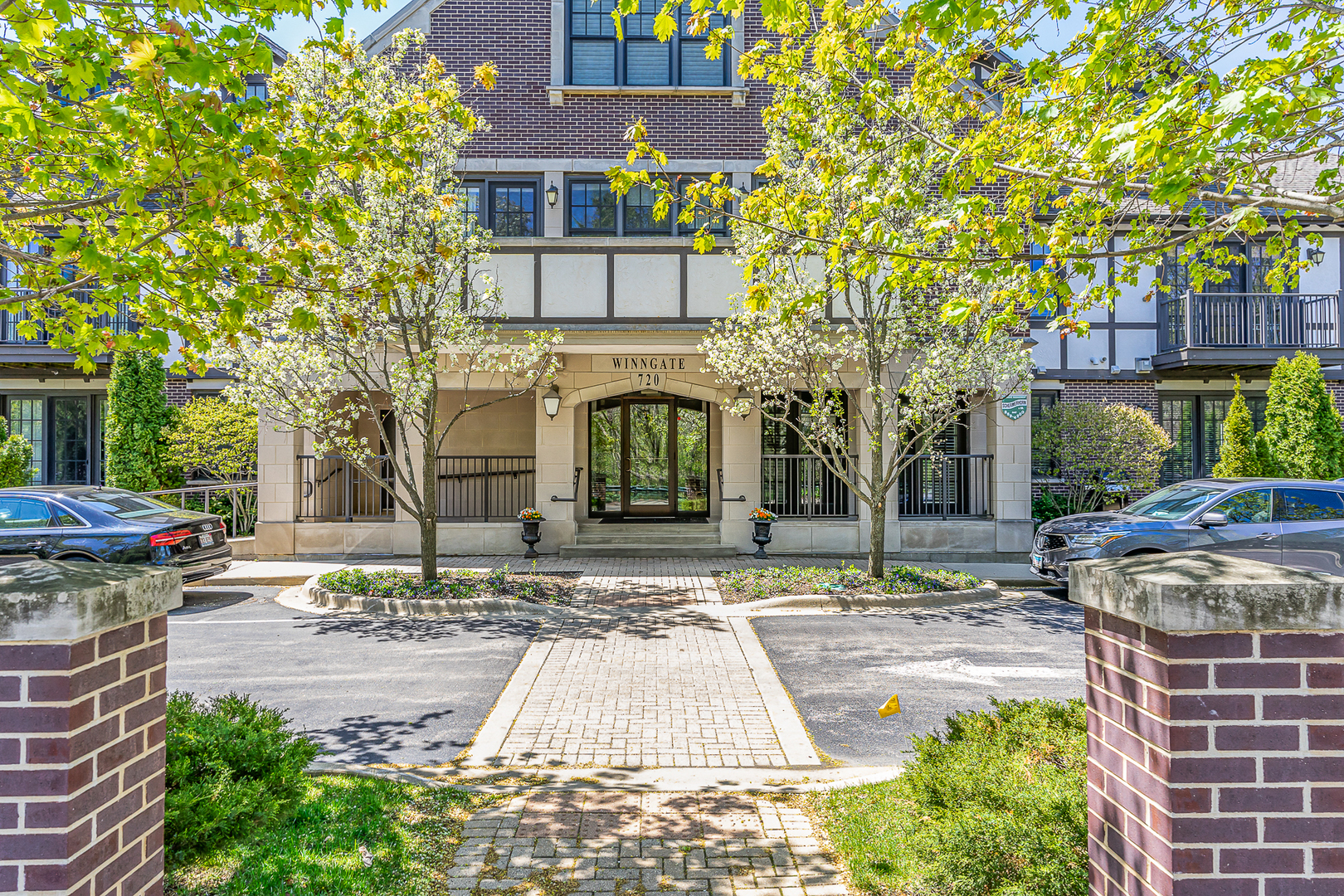 720 Green Bay Road, Unit 2E Winnetka, IL 60093 - Photo 2 of 15 a view of a brick building with many windows