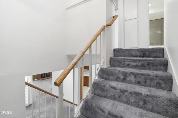 a view of an empty room with stairs