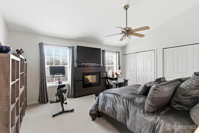 a view of a livingroom with furniture and a flat screen tv