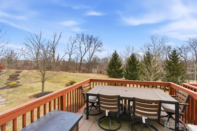 a view of a chairs and table on the deck