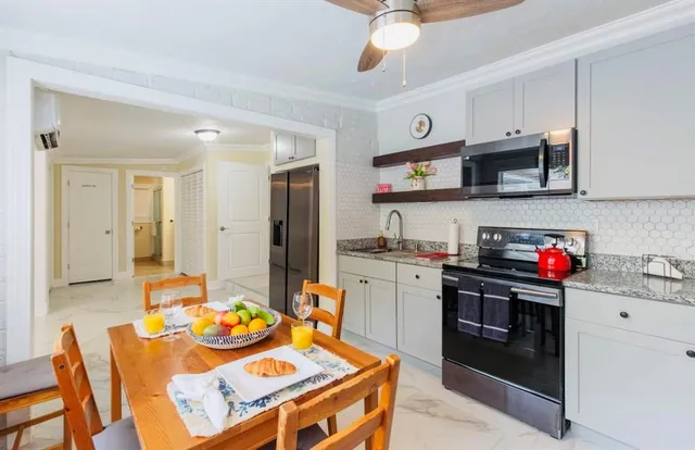 a living room filled with furniture and a table