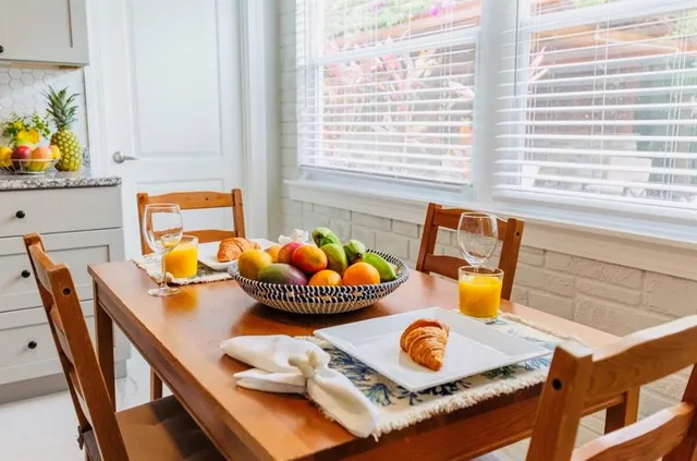 a bedroom with a bed and a night stand