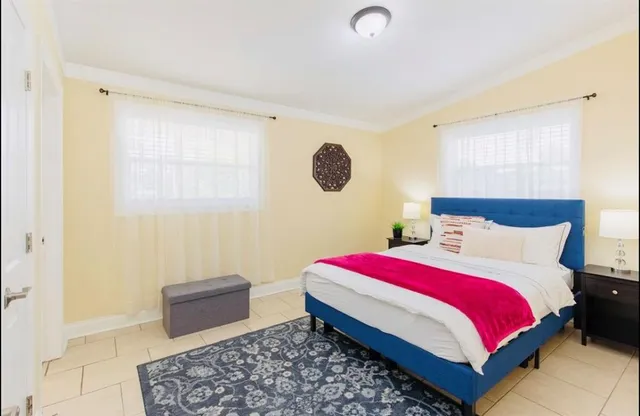 a bathroom with a sink toilet and mirror