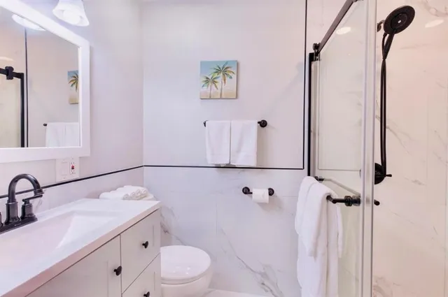 a view of an outdoor sitting area with chairs and fire pit