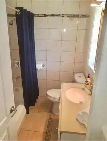 an outdoor space with furniture and umbrella