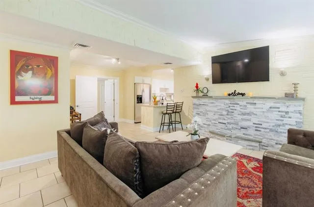 a kitchen with a table chairs stove and cabinets