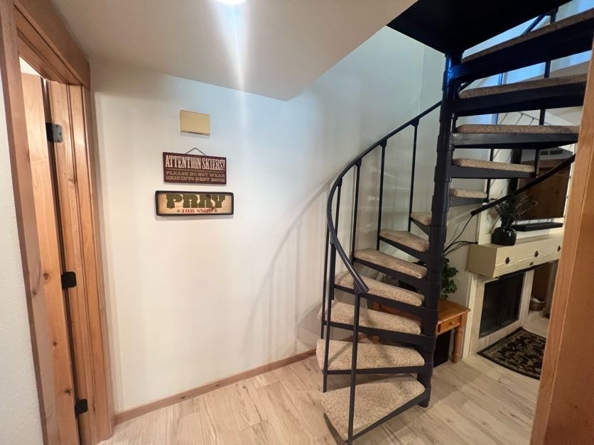 1937 Soda Ridge Road, Unit 1122 Keystone, CO 80435 - Photo 29 of 39 a view of staircase with wooden floor and a window