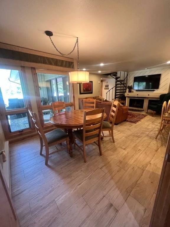 1937 Soda Ridge Road, Unit 1122 Keystone, CO 80435 - Photo 9 of 39 a dining room with furniture and wooden floor