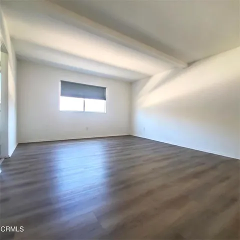 a spacious bathroom with a double vanity sink and mirror