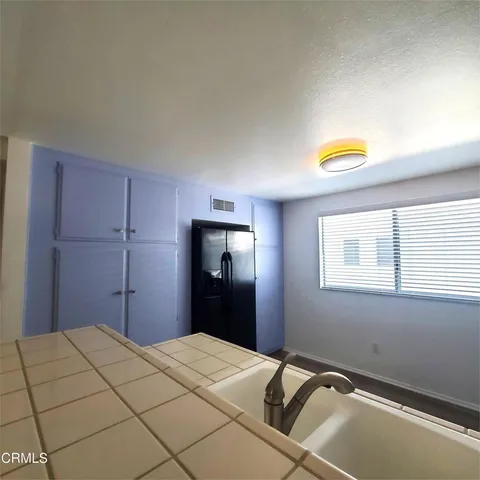 a bedroom with a bed and a cabinets