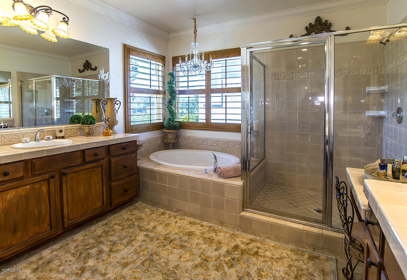 376 Woodland Road Simi Valley, CA 93065 - Photo 22 of 50 a bathroom with a tub sink shower and mirror
