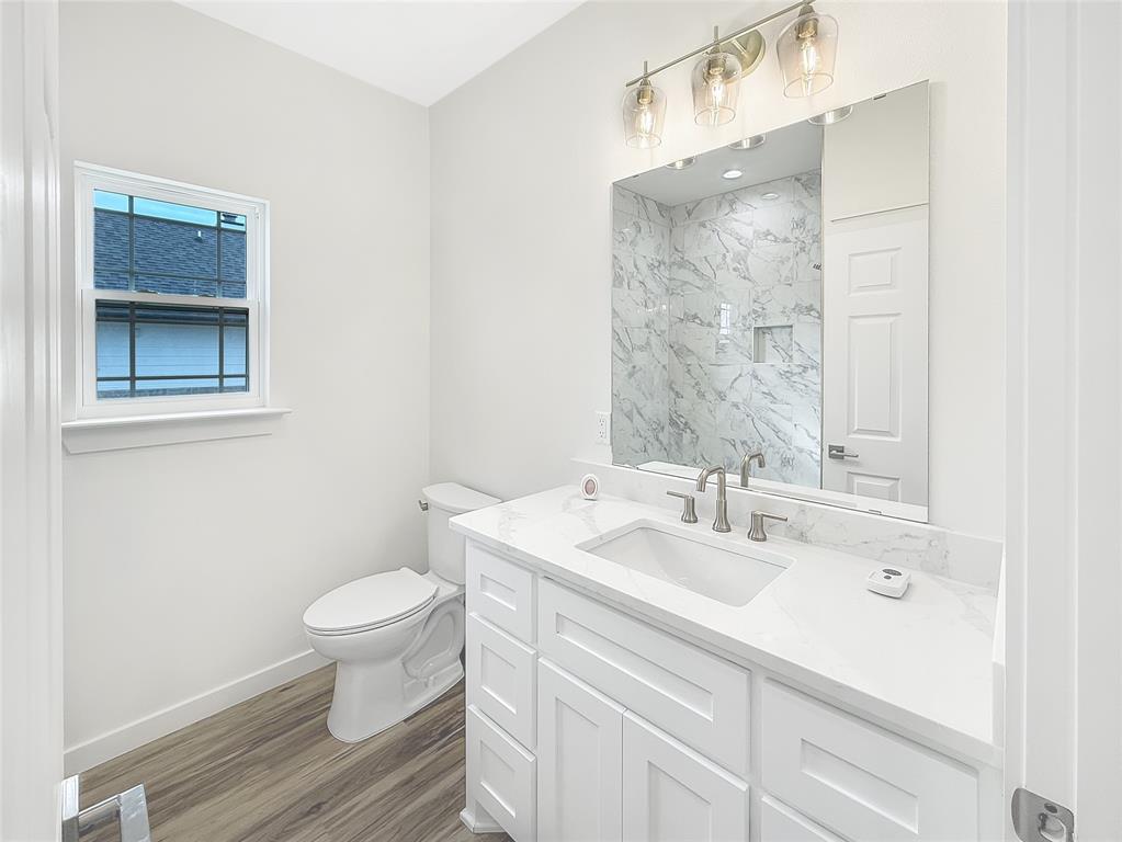 6472 Old Clarksville Road Reno, TX 75462 - Photo 16 of 22 a bathroom with a sink toilet and shower