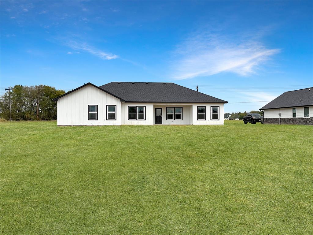 6472 Old Clarksville Road Reno, TX 75462 - Photo 21 of 22 a view of house with a big yard