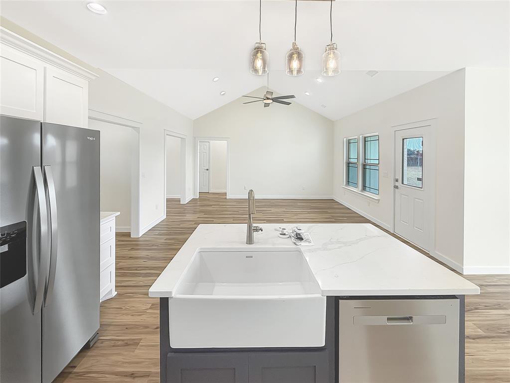6472 Old Clarksville Road Reno, TX 75462 - Photo 3 of 22 a kitchen with kitchen island a sink stainless steel appliances and window
