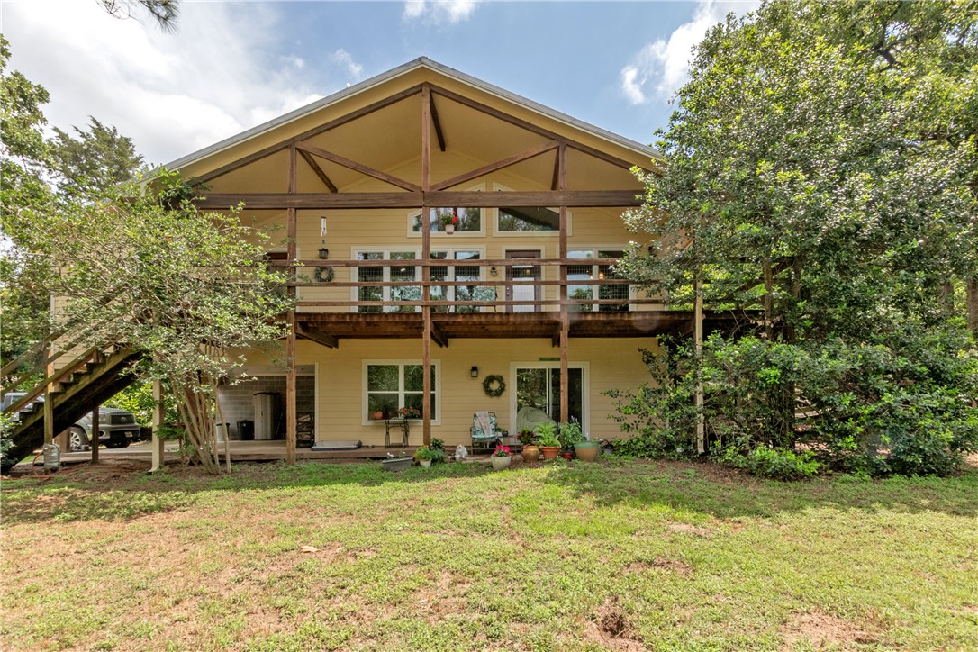 9997 Calhoun Road Bryan, TX 77808 - Photo 1 of 50 a view of a house with backyard and sitting area