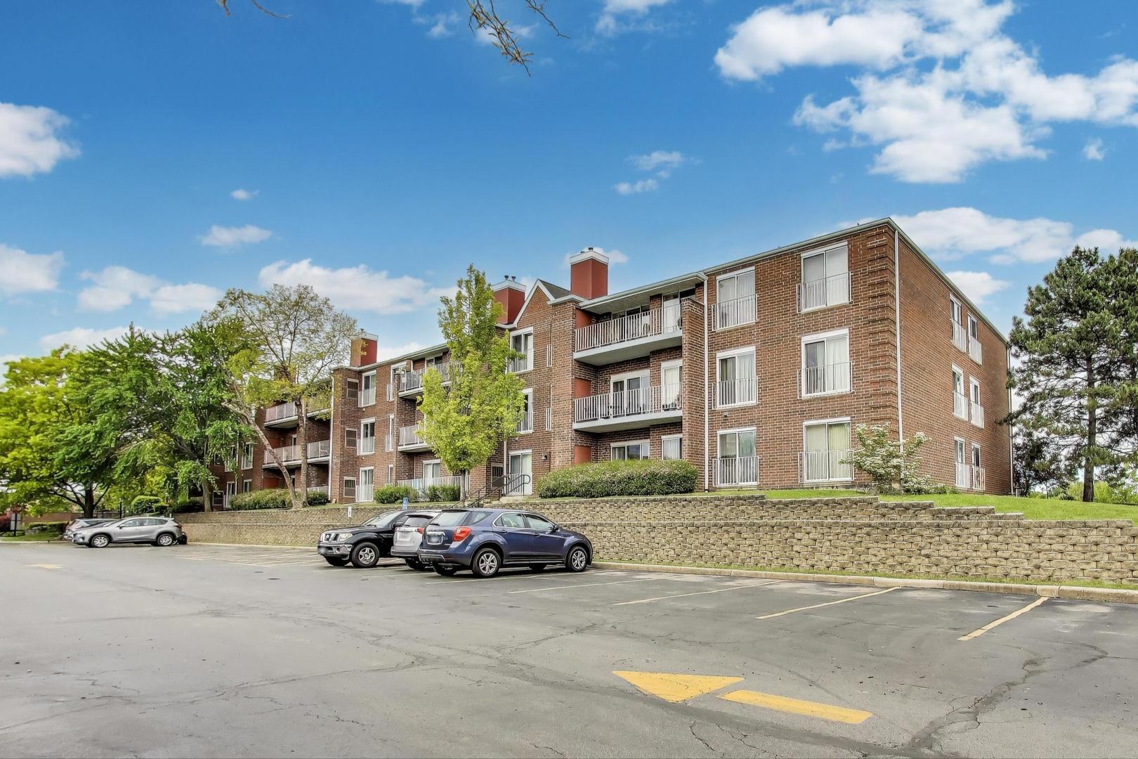 805 Leicester Road, Unit B105 Elk Grove Village, IL 60007 - Photo 1 of 37 a car parked in front of a building